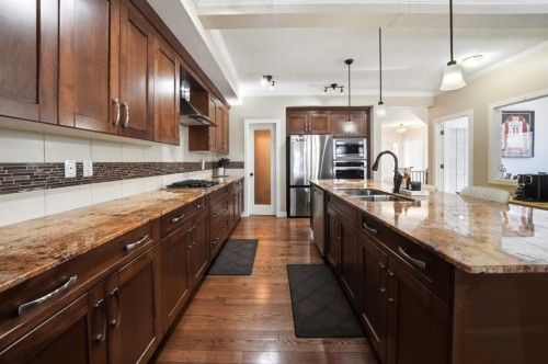 247 Kingston Way Se, Airdrie, AB - Indoor Photo Showing Kitchen With Double Sink With Upgraded Kitchen