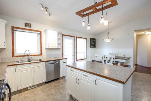 27 Falcon Crescent, Sylvan Lake, AB - Indoor Photo Showing Kitchen With Double Sink