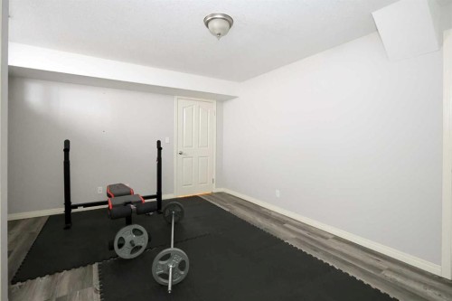 27 Falcon Crescent, Sylvan Lake, AB - Indoor Photo Showing Gym Room