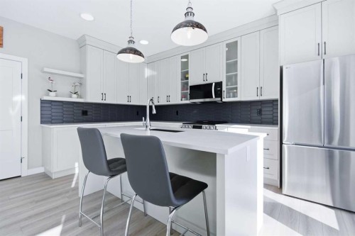 130 Mitchell Crescent, Blackfalds, AB - Indoor Photo Showing Kitchen With Double Sink With Upgraded Kitchen