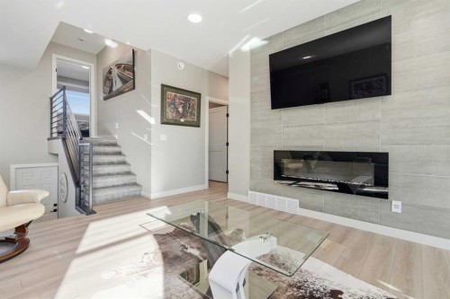 130 Mitchell Crescent, Blackfalds, AB - Indoor Photo Showing Living Room With Fireplace