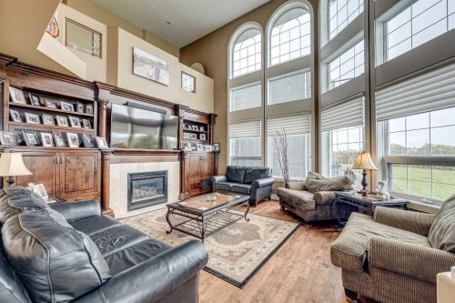 4300 Memorial Trail, Sylvan Lake, AB - Indoor Photo Showing Living Room With Fireplace