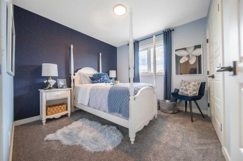 571 Buffaloberry Manor Se, Calgary, AB - Indoor Photo Showing Bedroom