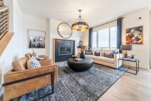 571 Buffaloberry Manor Se, Calgary, AB - Indoor Photo Showing Living Room With Fireplace