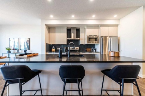 405 Sora Way Se, Calgary, AB - Indoor Photo Showing Kitchen With Stainless Steel Kitchen With Upgraded Kitchen