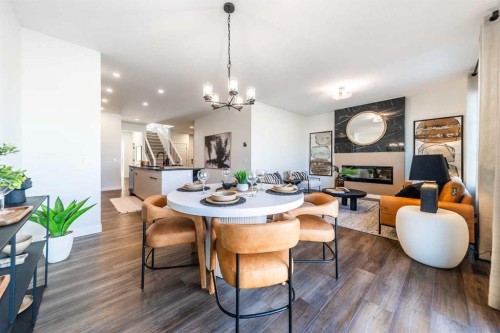405 Sora Way Se, Calgary, AB - Indoor Photo Showing Dining Room With Fireplace