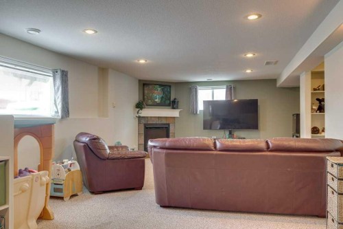 224 Iverson Close, Red Deer, AB - Indoor Photo Showing Basement With Fireplace