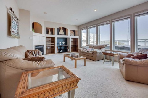 384 Marina Bay Place, Sylvan Lake, AB - Indoor Photo Showing Living Room With Fireplace