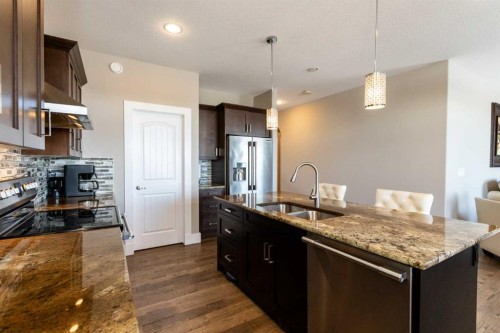 5824 Maple Crescent, Innisfail, AB - Indoor Photo Showing Kitchen With Double Sink With Upgraded Kitchen