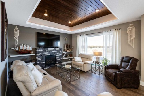 5824 Maple Crescent, Innisfail, AB - Indoor Photo Showing Living Room With Fireplace