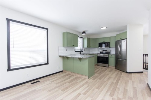 16 Johnson Close, Penhold, AB - Indoor Photo Showing Kitchen With Stainless Steel Kitchen