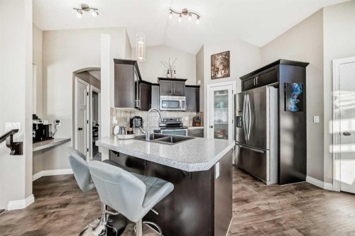 668 Robinson Avenue, Penhold, AB - Indoor Photo Showing Kitchen With Stainless Steel Kitchen With Double Sink