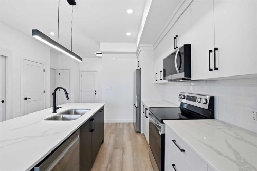 41 Violet Point, Sylvan Lake, AB - Indoor Photo Showing Kitchen With Double Sink With Upgraded Kitchen