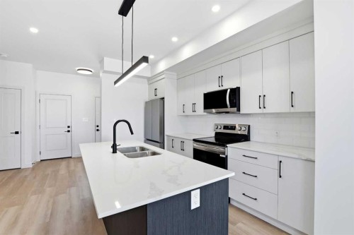 41 Violet Point, Sylvan Lake, AB - Indoor Photo Showing Kitchen With Double Sink With Upgraded Kitchen