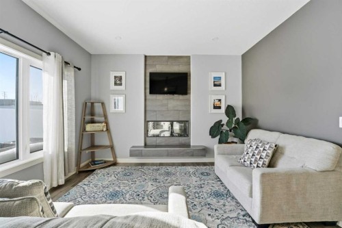 20 Cole Way, Sylvan Lake, AB - Indoor Photo Showing Living Room With Fireplace