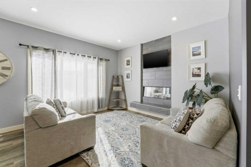 20 Cole Way, Sylvan Lake, AB - Indoor Photo Showing Living Room With Fireplace