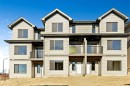 358 Heritage Boulevard, Cochrane, AB  - Outdoor With Balcony With Facade 