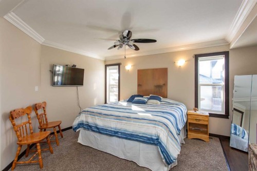 150 Robinson Avenue, Penhold, AB - Indoor Photo Showing Bedroom