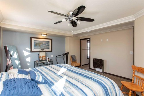 150 Robinson Avenue, Penhold, AB - Indoor Photo Showing Bedroom