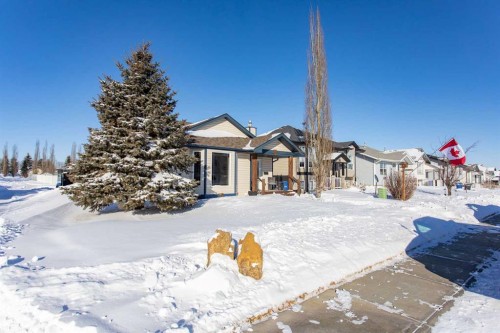 150 Robinson Avenue, Penhold, AB - Outdoor With Facade