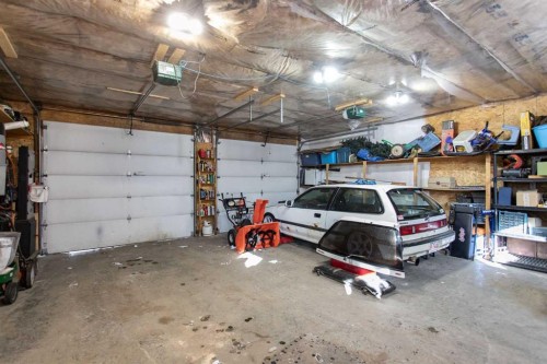 150 Robinson Avenue, Penhold, AB - Indoor Photo Showing Garage