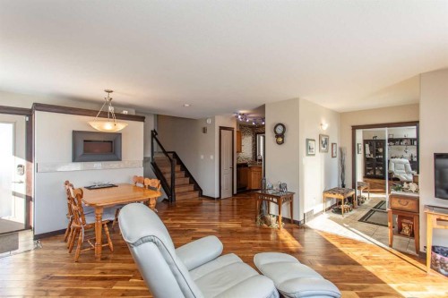 150 Robinson Avenue, Penhold, AB - Indoor Photo Showing Living Room With Fireplace