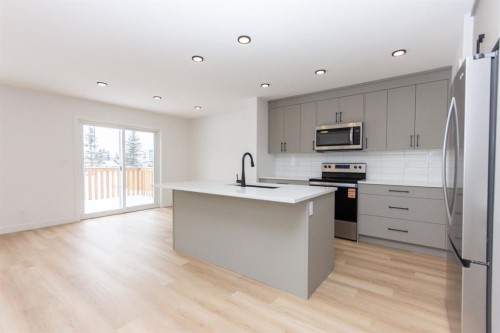 12 Trinity Street, Lacombe, AB - Indoor Photo Showing Kitchen With Stainless Steel Kitchen With Upgraded Kitchen