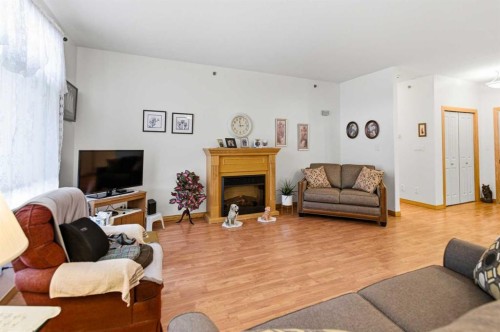 412-5213 61 Street, Red Deer, AB - Indoor Photo Showing Living Room With Fireplace