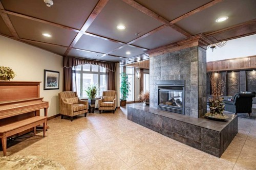 412-5213 61 Street, Red Deer, AB - Indoor With Fireplace