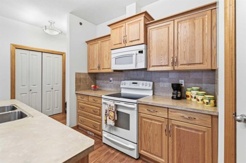 412-5213 61 Street, Red Deer, AB - Indoor Photo Showing Kitchen With Double Sink