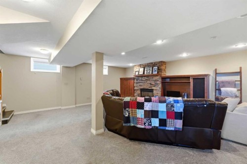 4409 43 Avenue, Red Deer, AB - Indoor Photo Showing Basement With Fireplace