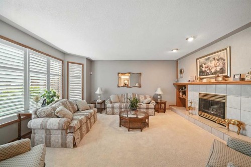 107 Allison Crescent, Red Deer, AB - Indoor Photo Showing Living Room With Fireplace