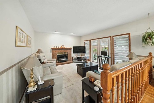 107 Allison Crescent, Red Deer, AB - Indoor Photo Showing Living Room With Fireplace