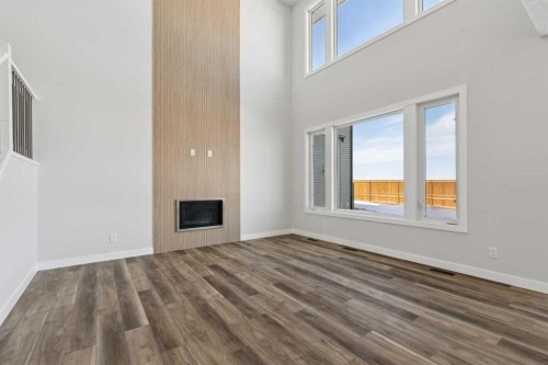 420 Bridgeport Glen, Chestermere, AB - Indoor Photo Showing Other Room With Fireplace