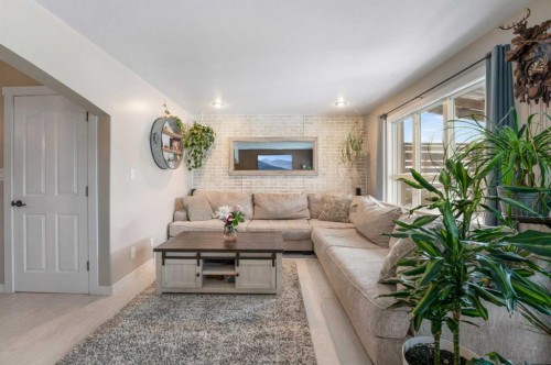 32 Legend Court, Sylvan Lake, AB - Indoor Photo Showing Living Room With Fireplace