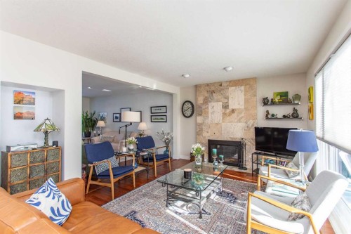18 Mclevin Crescent, Red Deer, AB - Indoor Photo Showing Living Room With Fireplace