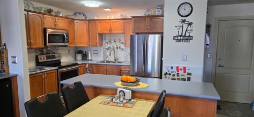 405-4425 Heritage Way, Lacombe, AB - Indoor Photo Showing Kitchen With Double Sink
