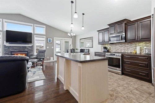 69 Turner Crescent, Red Deer, AB - Indoor Photo Showing Kitchen With Fireplace With Upgraded Kitchen