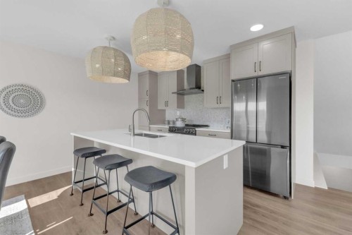 107 Hampton Crescent, Sylvan Lake, AB - Indoor Photo Showing Kitchen With Double Sink With Upgraded Kitchen