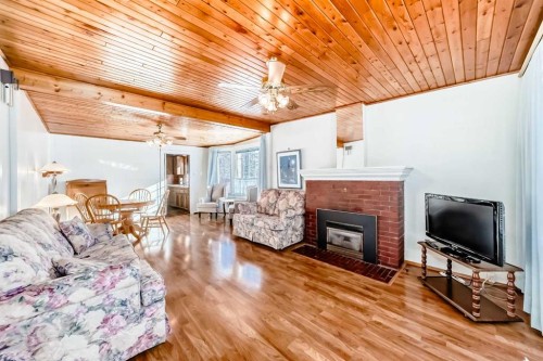 5306 52 Avenue, Ponoka, AB - Indoor Photo Showing Living Room With Fireplace