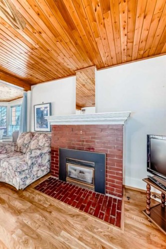 5306 52 Avenue, Ponoka, AB - Indoor Photo Showing Living Room With Fireplace