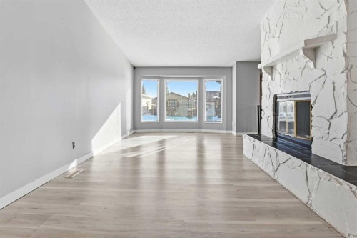 46 Duncan Crescent, Red Deer, AB - Indoor Photo Showing Other Room With Fireplace