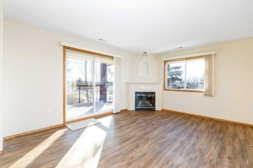 328-18 Averill Street, Red Deer, AB - Indoor Photo Showing Living Room With Fireplace