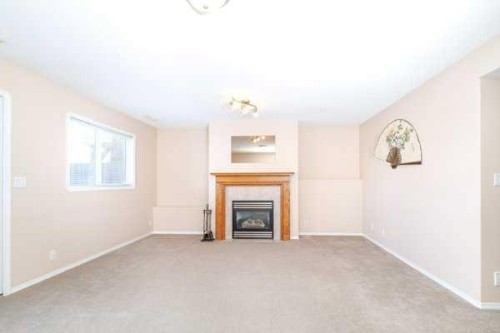12 Dentoom, Red Deer, AB - Indoor Photo Showing Living Room With Fireplace