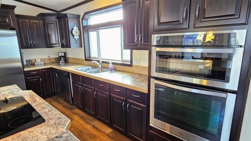 205 4 Street Nw, Sundre, AB - Indoor Photo Showing Kitchen With Double Sink