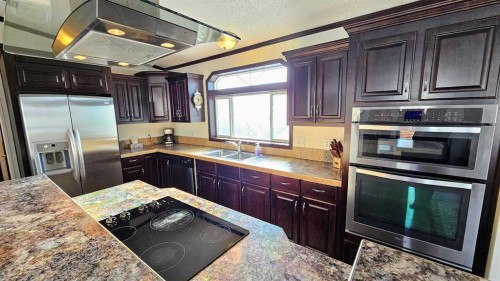 205 4 Street Nw, Sundre, AB - Indoor Photo Showing Kitchen With Stainless Steel Kitchen With Double Sink