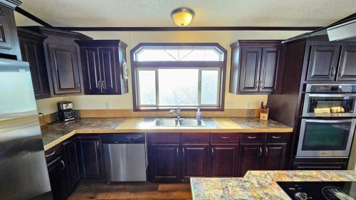 205 4 Street Nw, Sundre, AB - Indoor Photo Showing Kitchen With Double Sink