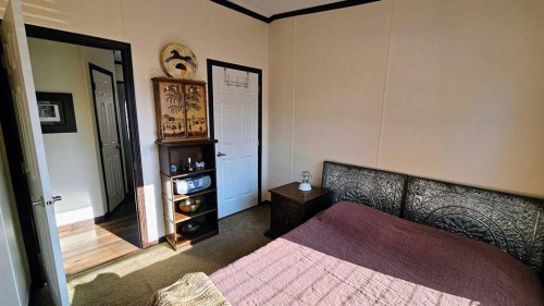 205 4 Street Nw, Sundre, AB - Indoor Photo Showing Bedroom