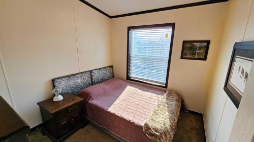 205 4 Street Nw, Sundre, AB - Indoor Photo Showing Bedroom