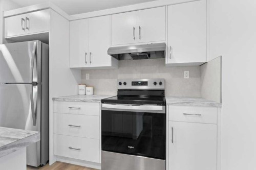 47 Louis Drive, Rural Red Deer County, AB - Indoor Photo Showing Kitchen With Upgraded Kitchen